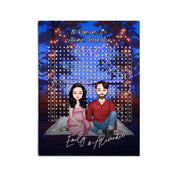 10 Reasons It’s Always Been You personalized couple portrait word search canvas of two front-facing people sitting together under string lights by the water, with 10 custom words circled in the grid and their names displayed at the bottom — LOVECOUPLET