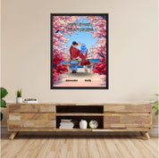 Personalized couple framed canvas of two people sitting together on a bench beneath blooming pink spring flowers, with a custom romantic quote above them and their names displayed at the bottom — LOVECOUPLET