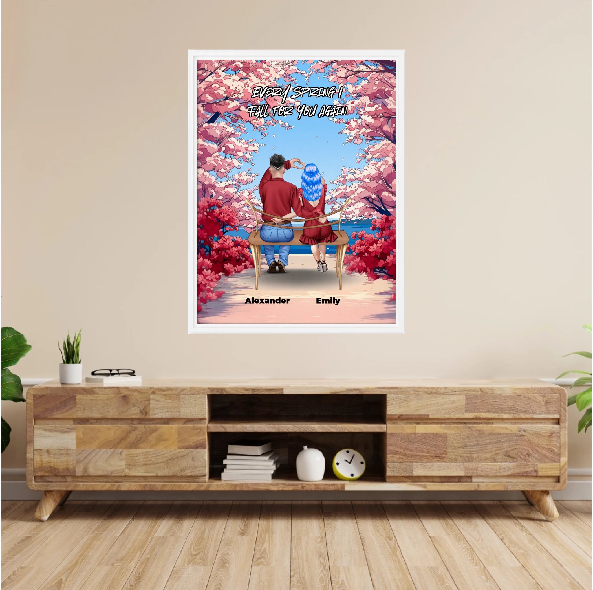 Personalized couple framed canvas of two people sitting together on a bench beneath blooming pink spring flowers, with a custom romantic quote above them and their names displayed at the bottom — LOVECOUPLET