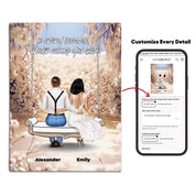 Personalized couple canvas of two people sitting together on a garden swing beneath soft blooming flowers, with a custom romantic quote above them and their names displayed at the bottom — LOVECOUPLET
