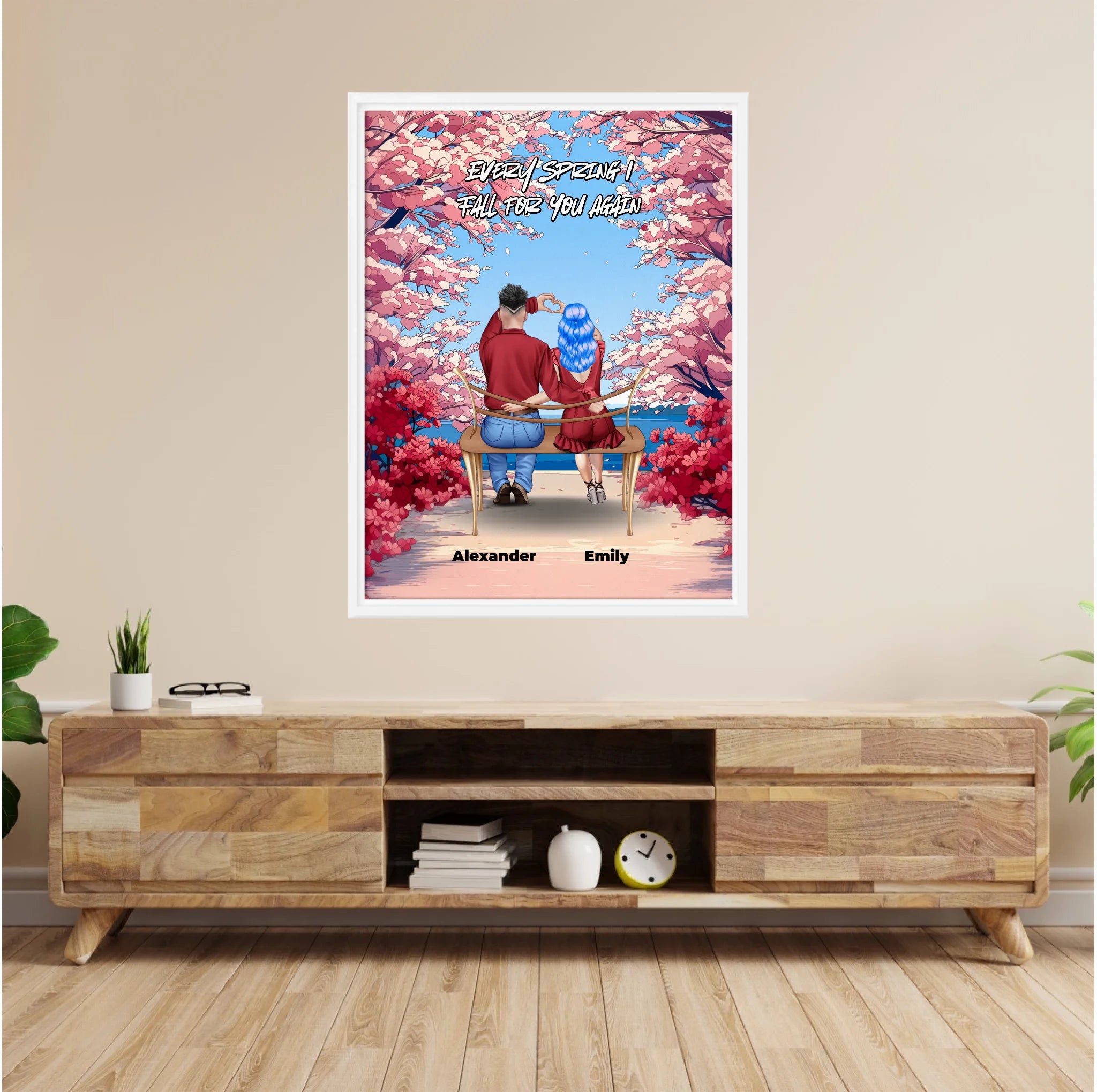 Personalized couple framed canvas of two people sitting together on a bench beneath blooming pink spring flowers, with a custom romantic quote above them and their names displayed at the bottom — LOVECOUPLET