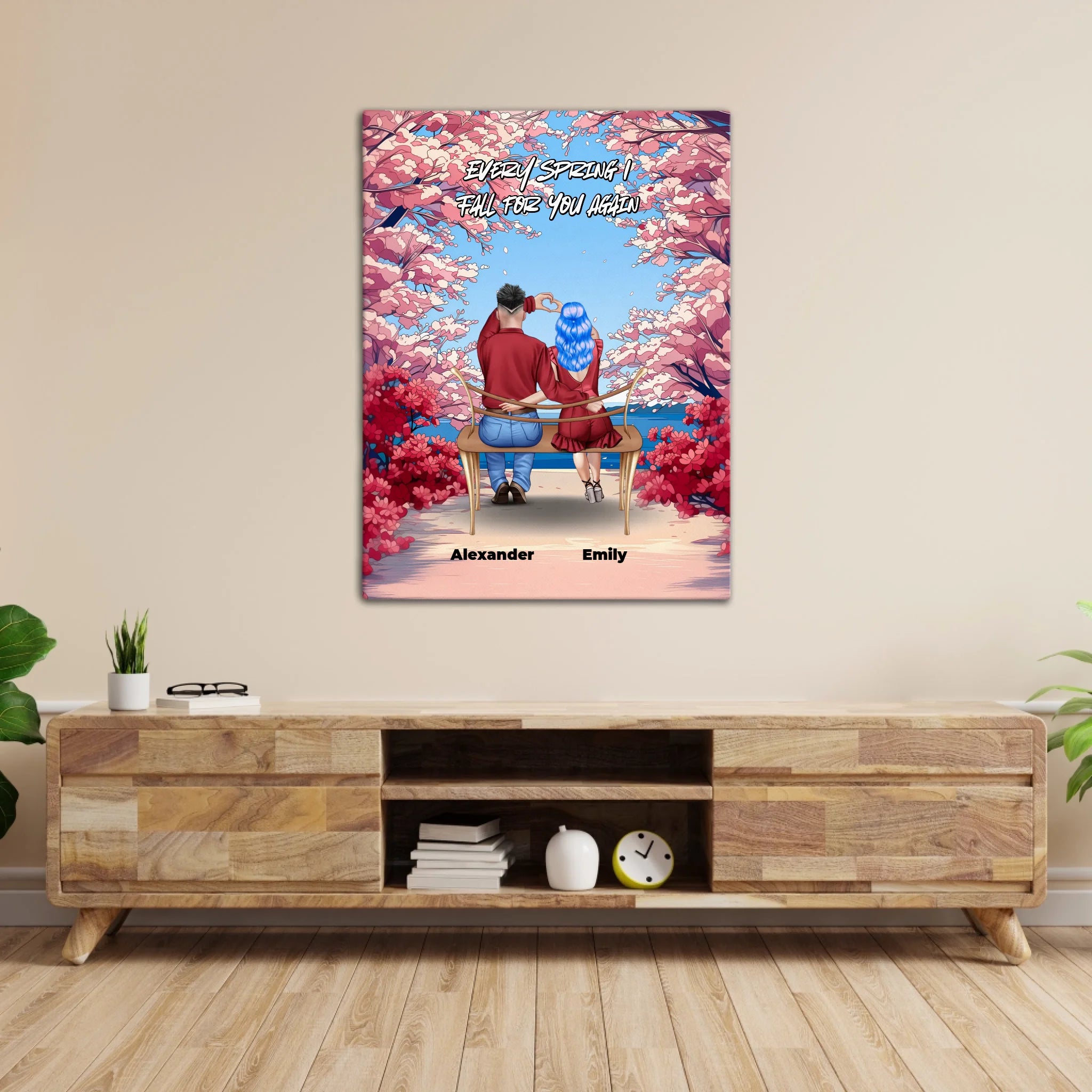 Personalized couple canvas of two people sitting together on a bench beneath blooming pink spring flowers, with a custom romantic quote above them and their names displayed at the bottom — LOVECOUPLET