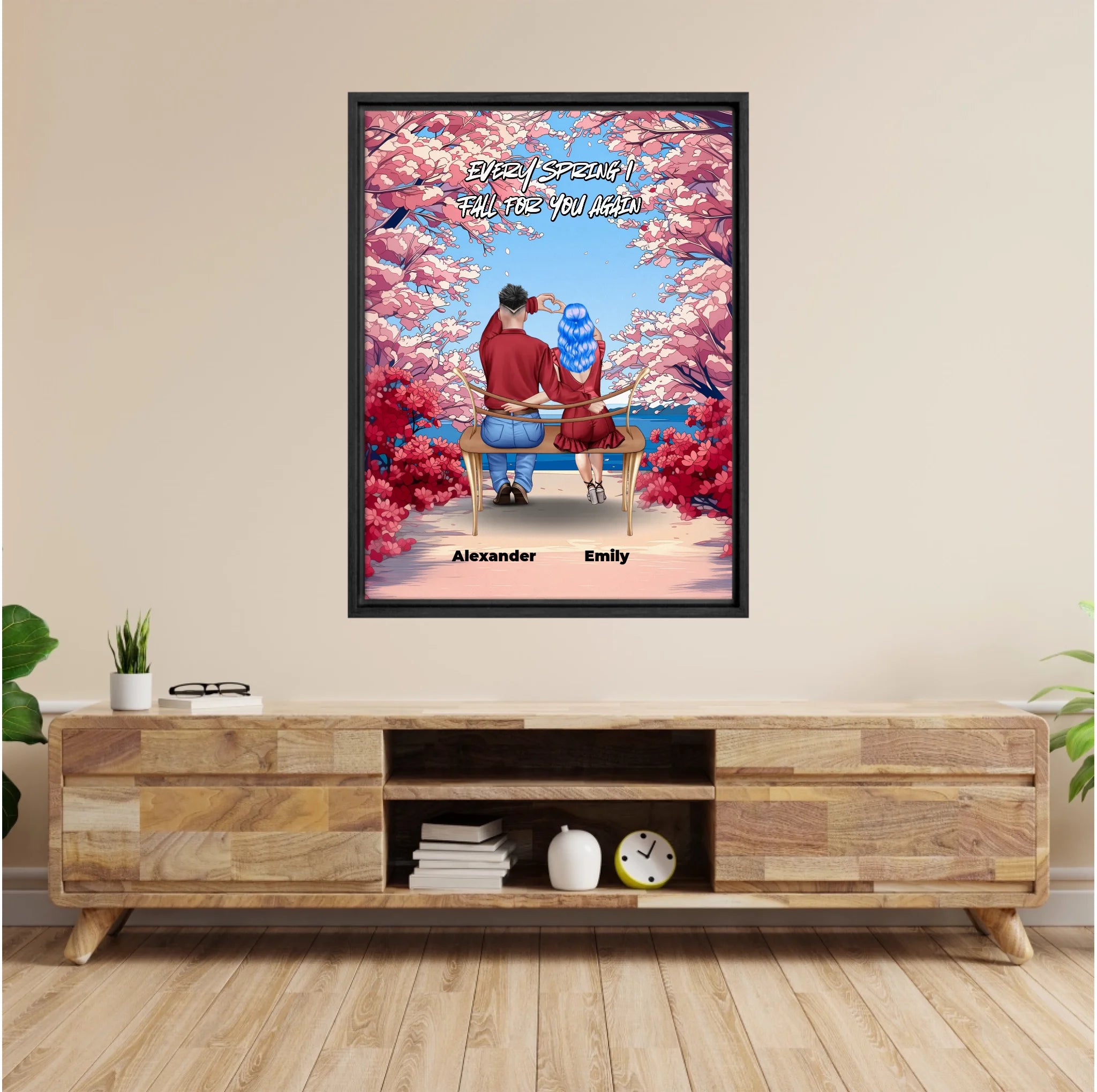 Personalized couple framed canvas of two people sitting together on a bench beneath blooming pink spring flowers, with a custom romantic quote above them and their names displayed at the bottom — LOVECOUPLET