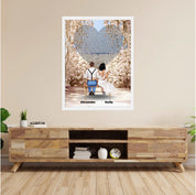 Personalized wedding couple framed canvas of a bride and groom sitting on a bench beneath a blooming floral garden arch, with custom lyrics shaped into a heart above them and their names at the base of the scene — LOVECOUPLET