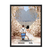 Personalized wedding couple framed canvas of a bride and groom sitting on a bench beneath a blooming floral garden arch, with custom lyrics shaped into a heart above them and their names at the base of the scene — LOVECOUPLET