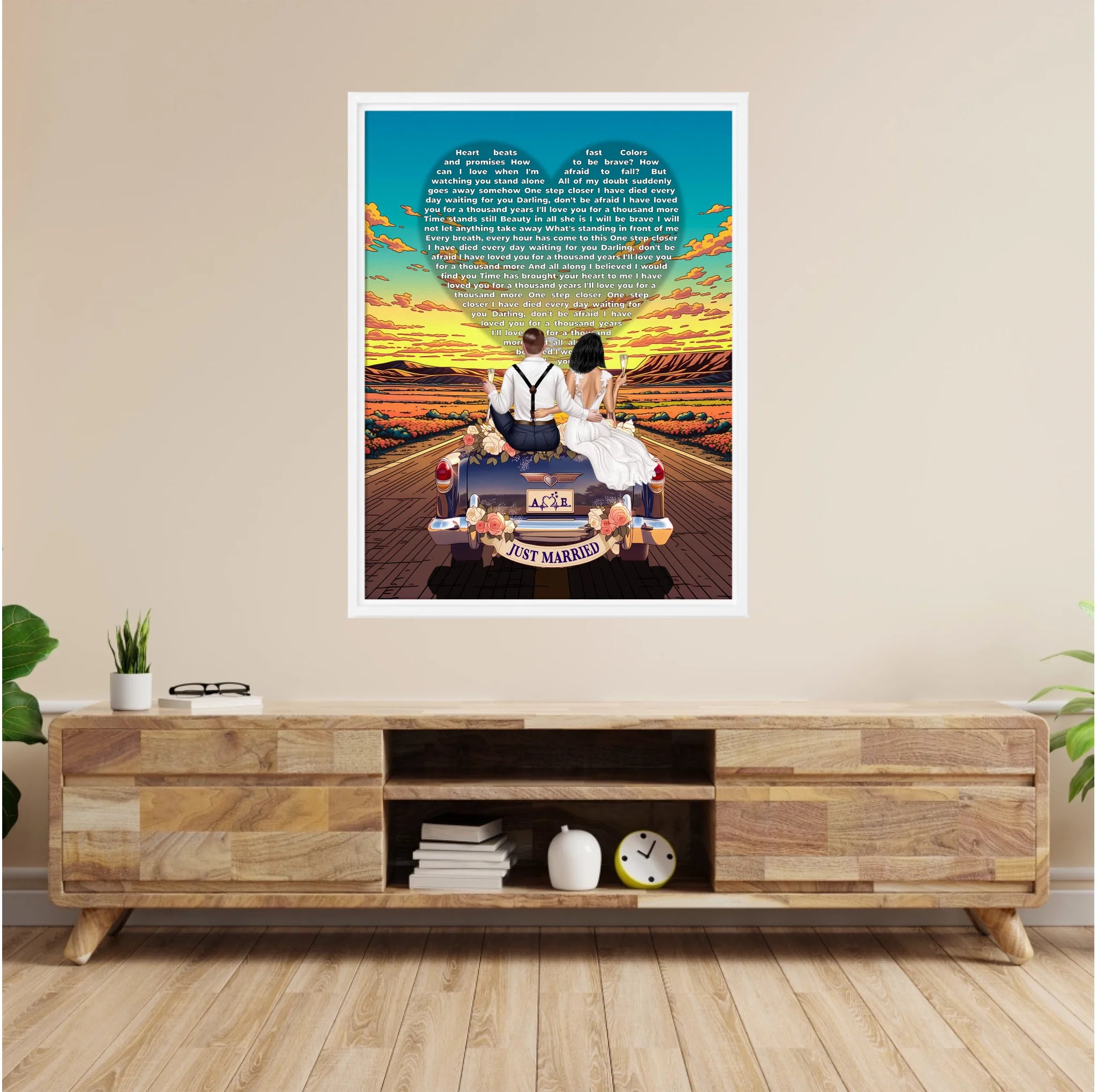 Personalized wedding framed canvas of a bride and groom on a flower-adorned vintage car with custom lyrics shaped into a heart above them, initials monogrammed on the license plate, and an open road stretching into a golden sunset — LOVECOUPLET