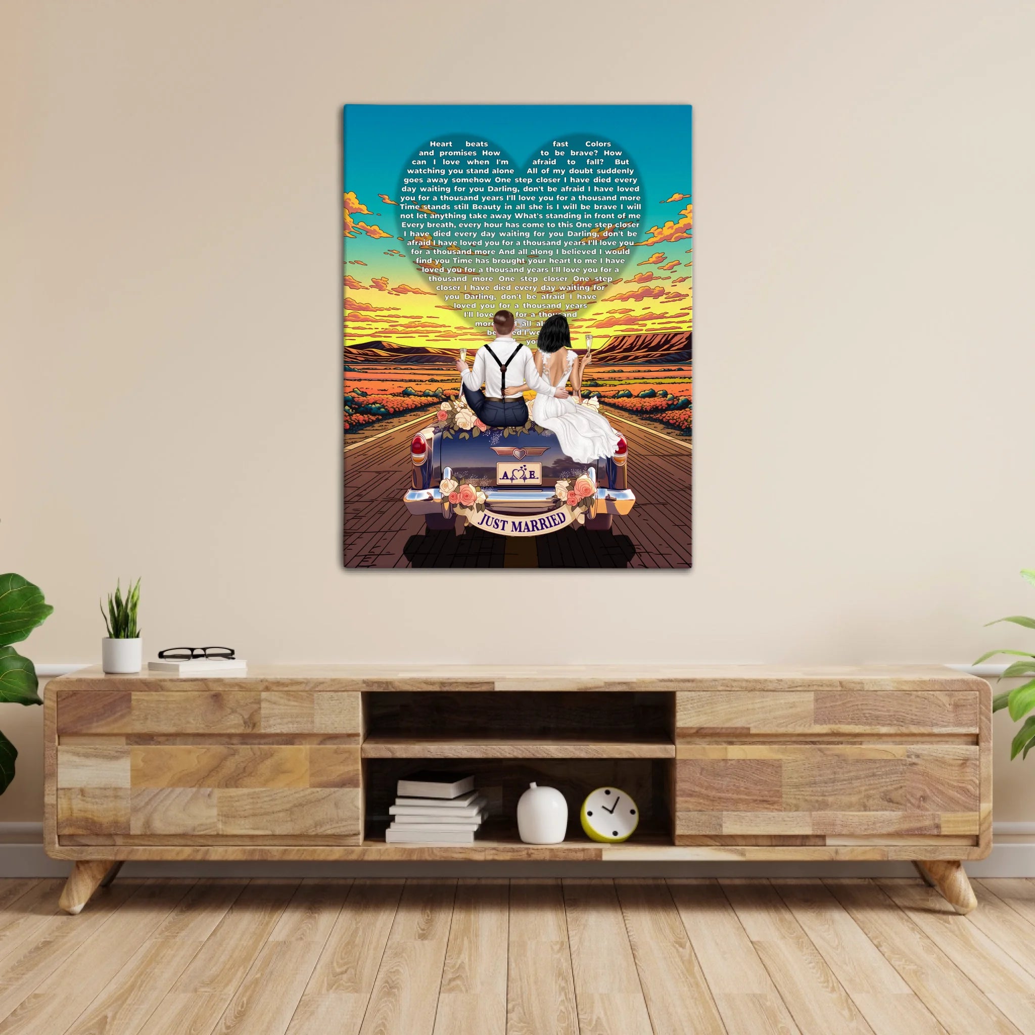 Personalized wedding canvas of a bride and groom on a flower-adorned vintage car with custom lyrics shaped into a heart above them, initials monogrammed on the license plate, and an open road stretching into a golden sunset — LOVECOUPLET