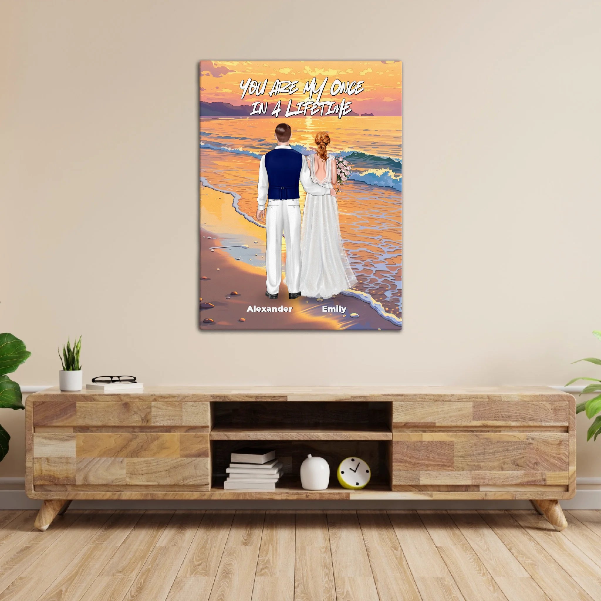 Once in a Lifetime personalized wedding couple canvas of two people standing together on a golden beach at sunset, with a custom romantic quote above them, names displayed at the bottom, and personalized wedding characters — LOVECOUPLET