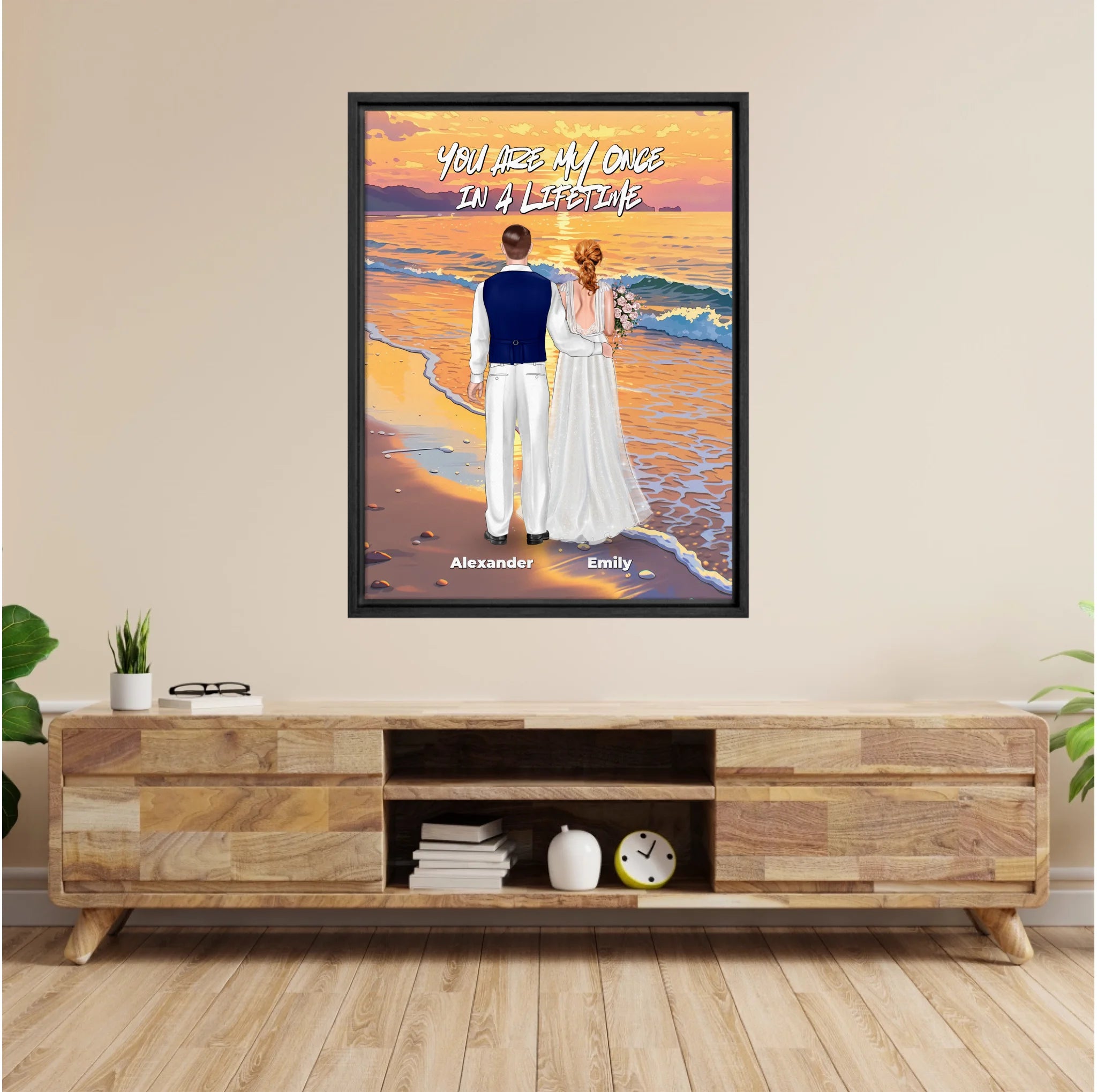Once in a Lifetime personalized wedding couple framed canvas of two people standing together on a golden beach at sunset, with a custom romantic quote above them, names displayed at the bottom, and personalized wedding characters — LOVECOUPLET