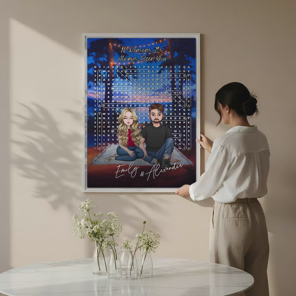 10 Reasons It’s Always Been You personalized couple portrait word search canvas of two front-facing people sitting together under string lights by the water, with 10 custom words circled in the grid and their names displayed at the bottom — LOVECOUPLET
