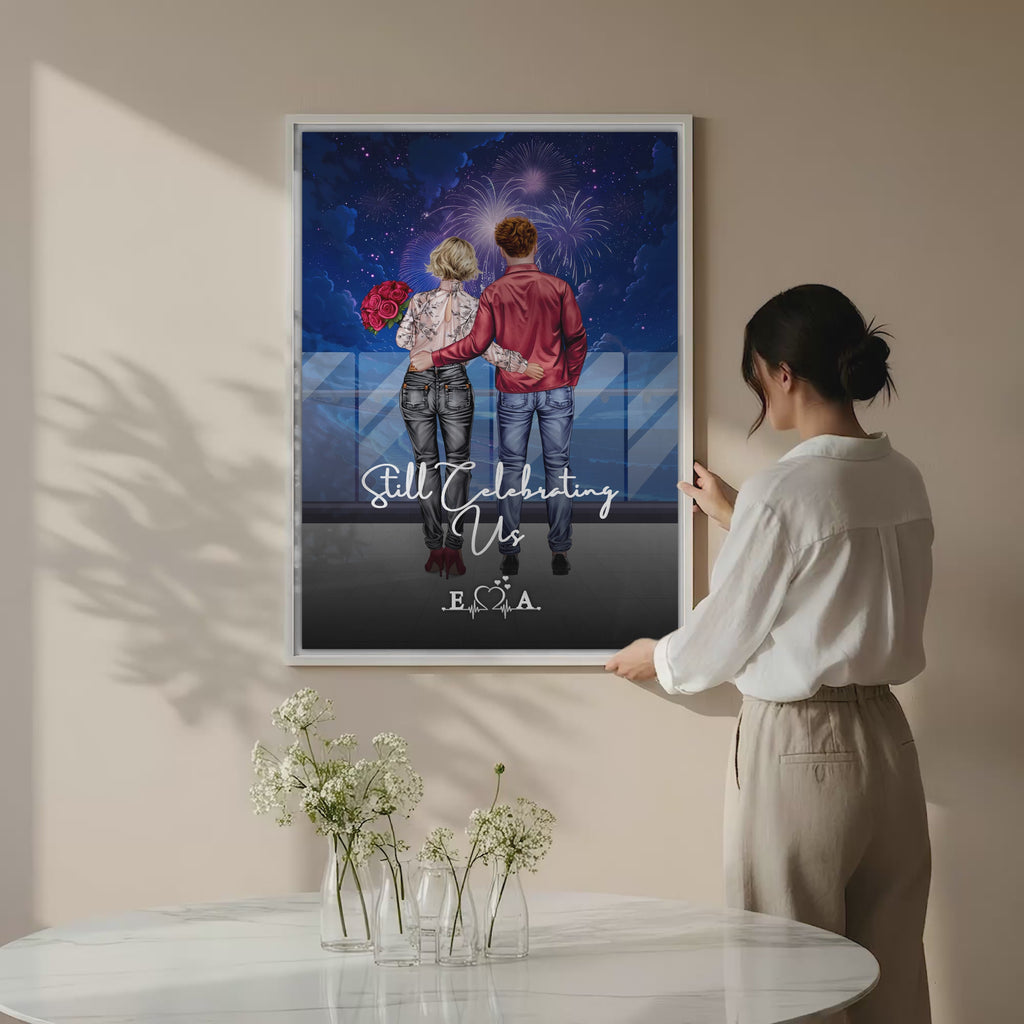 Still Celebrating Us personalized couple canvas of two people standing together on a balcony watching fireworks over the ocean, with a custom quote and heartbeat initials monogram below — LOVECOUPLET