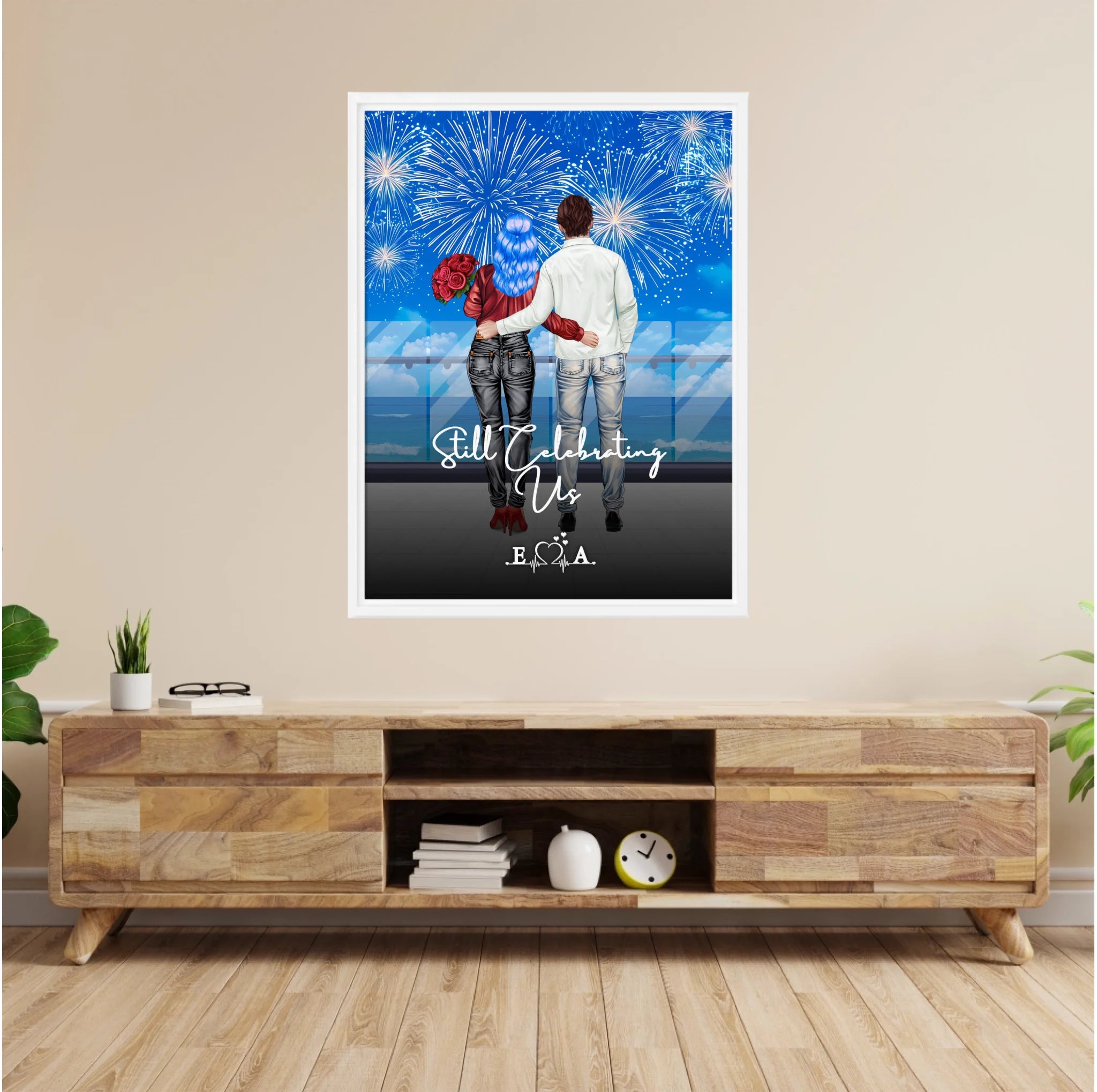 Still Celebrating Us personalized couple framed canvas of two people standing together on a balcony watching fireworks over the ocean, with a custom quote and heartbeat initials monogram below — LOVECOUPLET