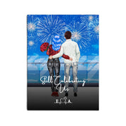 Still Celebrating Us personalized couple canvas of two people standing together on a balcony watching fireworks over the ocean, with a custom quote and heartbeat initials monogram below — LOVECOUPLET