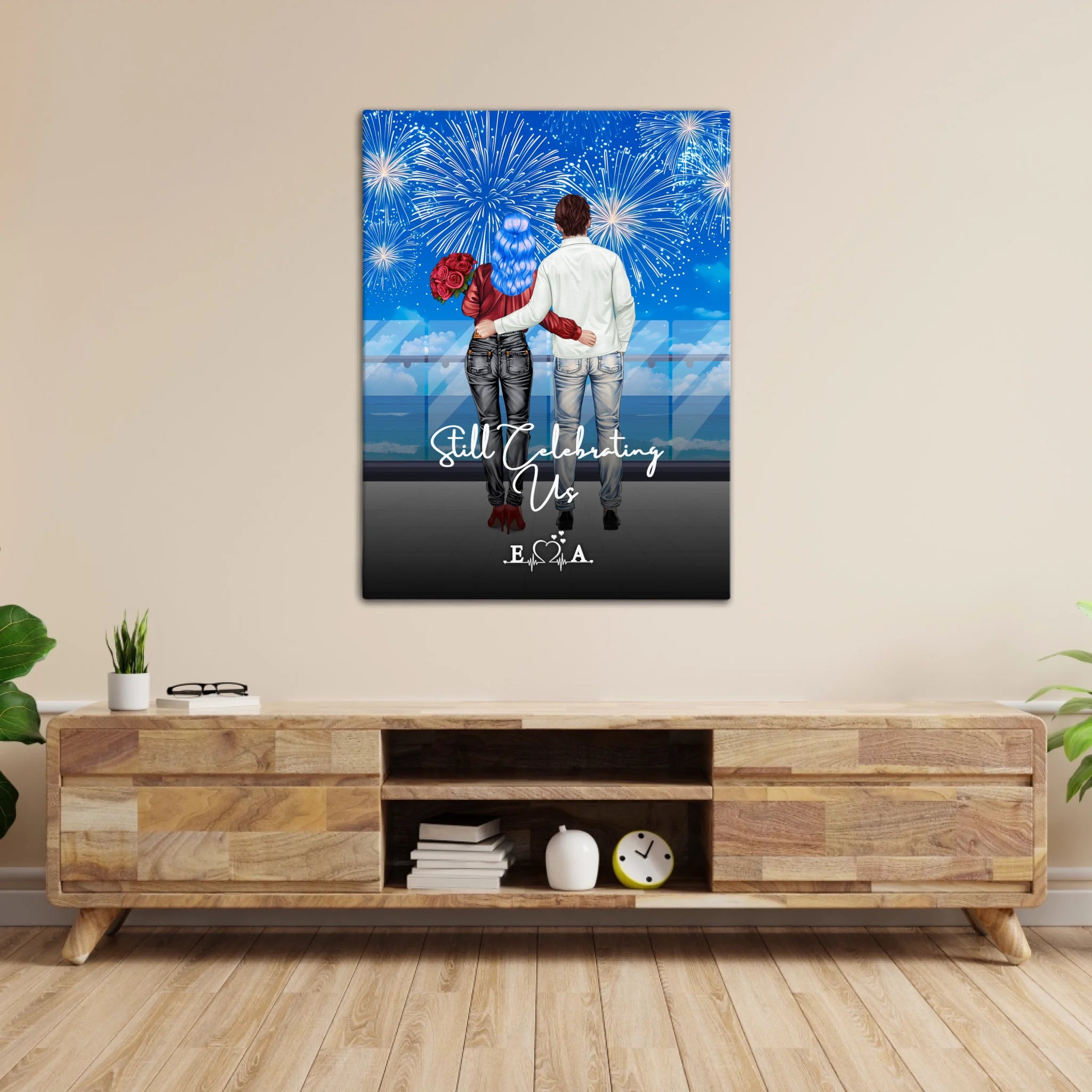 Still Celebrating Us personalized couple canvas of two people standing together on a balcony watching fireworks over the ocean, with a custom quote and heartbeat initials monogram below — LOVECOUPLET