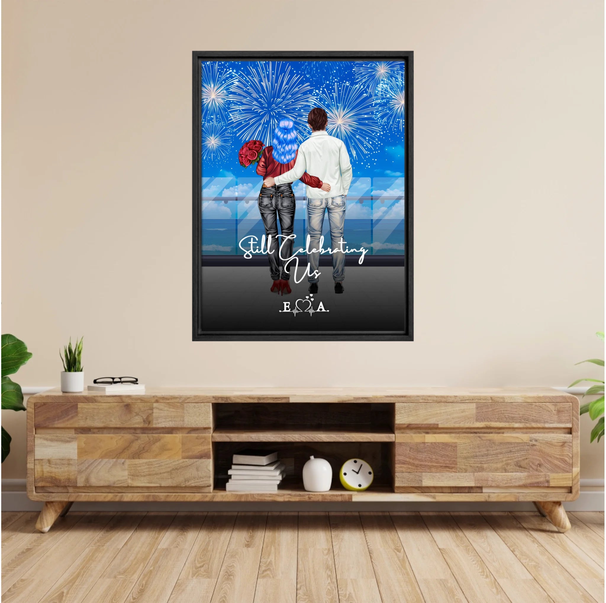 Still Celebrating Us personalized couple framed canvas of two people standing together on a balcony watching fireworks over the ocean, with a custom quote and heartbeat initials monogram below — LOVECOUPLET