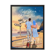 Personalized couple Framed canvas of a man and woman walking a coastal path at sunset, with a wooden signpost showing custom names and date, plus a custom location map and GPS coordinates built into the path — LOVECOUPLET