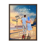 Personalized couple Framed canvas of a man and woman walking a coastal path at sunset, with a wooden signpost showing custom names and date, plus a custom location map and GPS coordinates built into the path — LOVECOUPLET