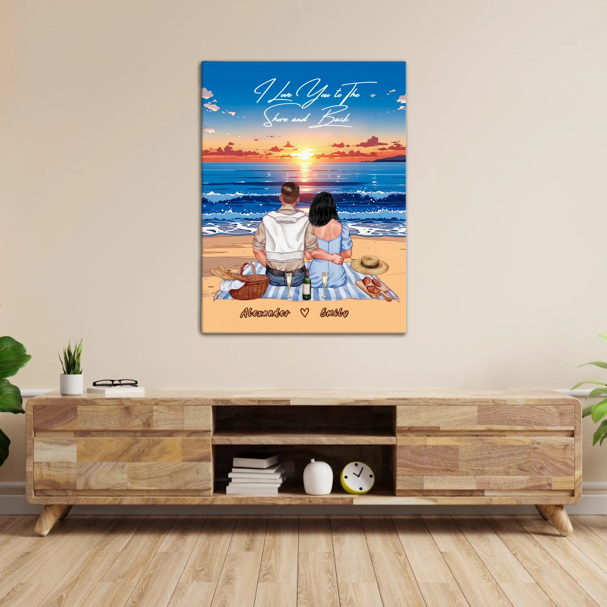 Personalized couple canvas of two people sitting together on a beach picnic blanket at sunset, with a custom romantic quote above the ocean and their names written in the sand — LOVECOUPLET