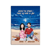 Personalized couple portrait canvas of two front-facing people sitting together on a beach picnic blanket under the stars, with customizable facial features, adult and senior couple options — LOVECOUPLET