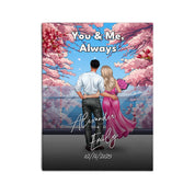 You & Me Always personalized couple canvas of two people standing together beneath blooming pink flowers, with a custom title, handwritten names, date, and personalized characters — LOVECOUPLET